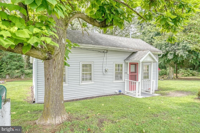 view of outbuilding with a lawn