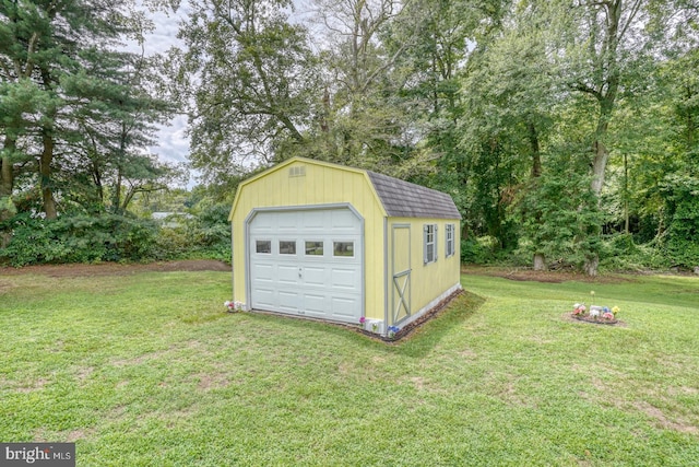 garage featuring a yard