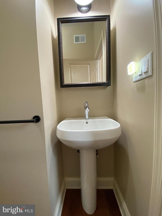 bathroom featuring hardwood / wood-style floors and sink