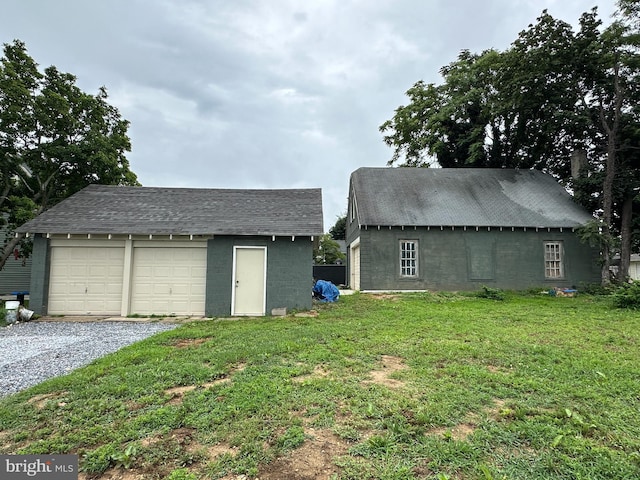 garage with a yard