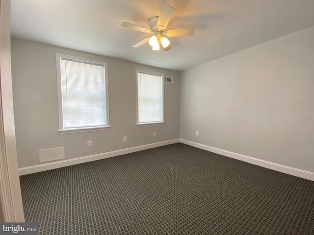 carpeted empty room with ceiling fan