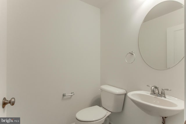 bathroom with toilet and sink