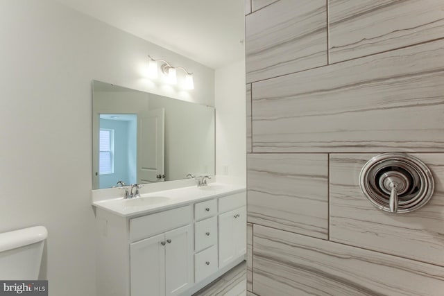 bathroom with toilet and vanity