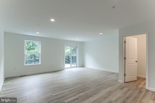 unfurnished room with light hardwood / wood-style flooring