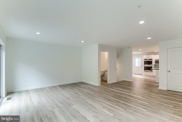 unfurnished living room featuring light hardwood / wood-style floors