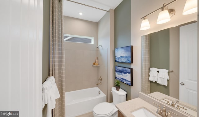 full bathroom with toilet, vanity, and shower / bath combo with shower curtain