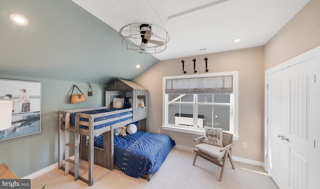 bedroom with carpet and vaulted ceiling