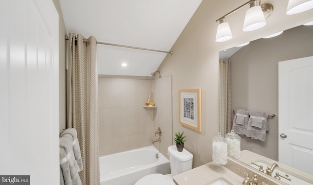 full bathroom featuring vaulted ceiling, toilet, vanity, and shower / tub combo with curtain