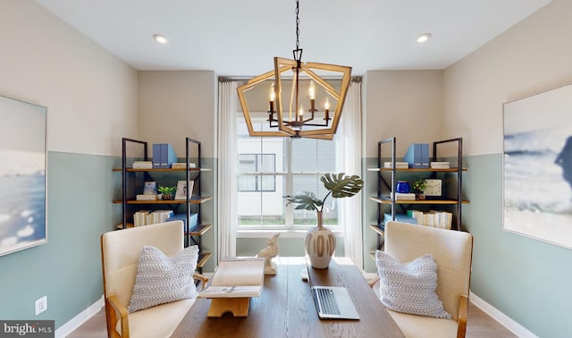 living area featuring hardwood / wood-style floors and a notable chandelier