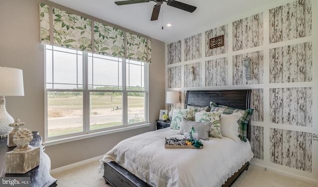 carpeted bedroom with ceiling fan