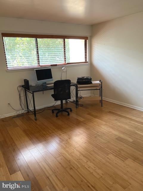 home office featuring light hardwood / wood-style floors