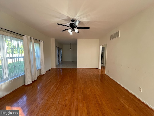 unfurnished room featuring ceiling fan and tile patterned flooring