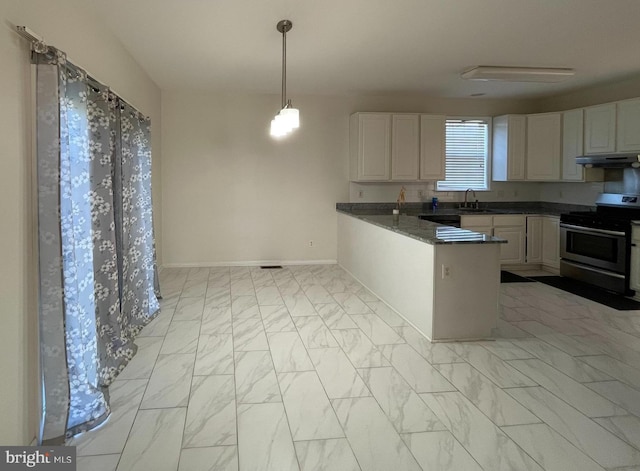 kitchen featuring white cabinetry, stainless steel stove, and light tile patterned floors