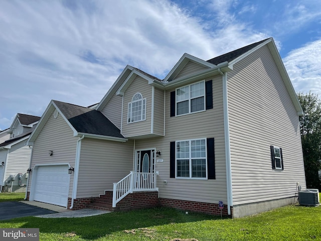 view of front of home featuring a front lawn, central air condition unit, and a garage