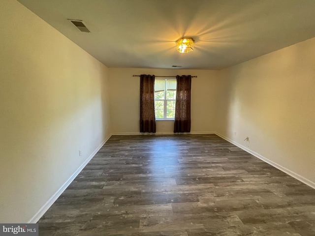 unfurnished room featuring hardwood / wood-style flooring