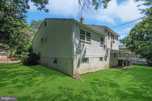 back of property featuring a lawn