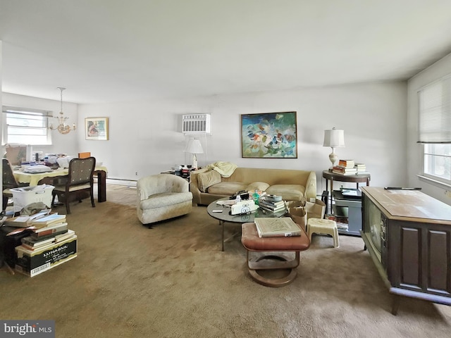 carpeted living room with plenty of natural light, a chandelier, and baseboard heating