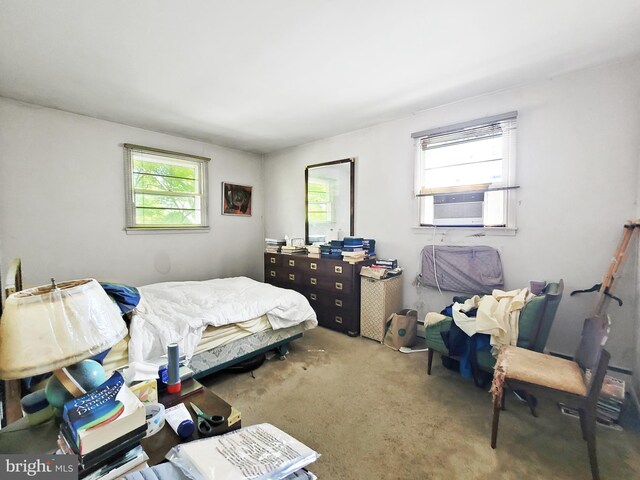 bedroom featuring cooling unit and carpet floors