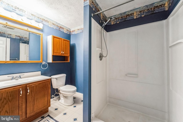 bathroom with a shower, tile patterned flooring, vanity, toilet, and a textured ceiling