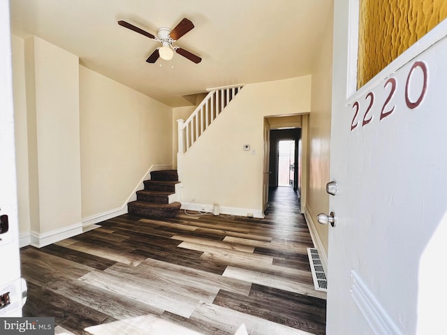 foyer featuring ceiling fan and dark hardwood / wood-style floors