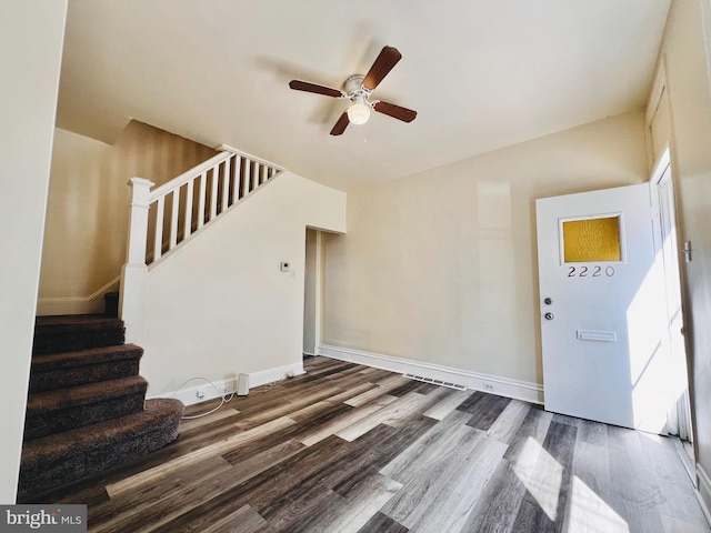 entryway with ceiling fan and wood-type flooring