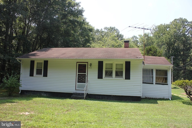 view of front of home with a front yard