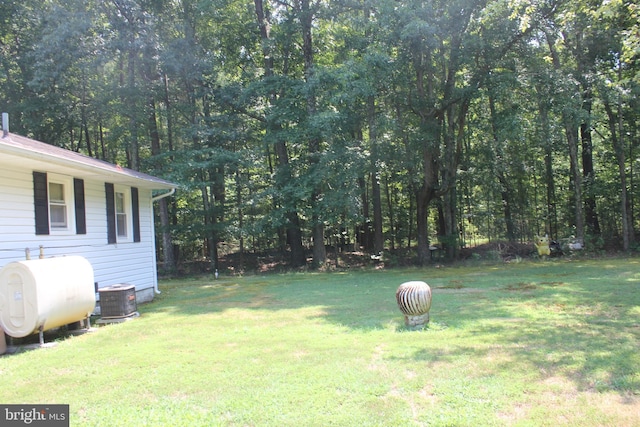 view of yard with central air condition unit