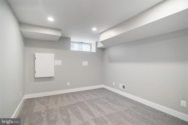 basement with light colored carpet