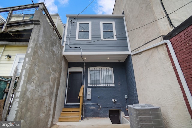 doorway to property featuring central AC unit