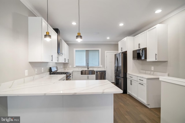 kitchen featuring stainless steel appliances, pendant lighting, white cabinets, and kitchen peninsula