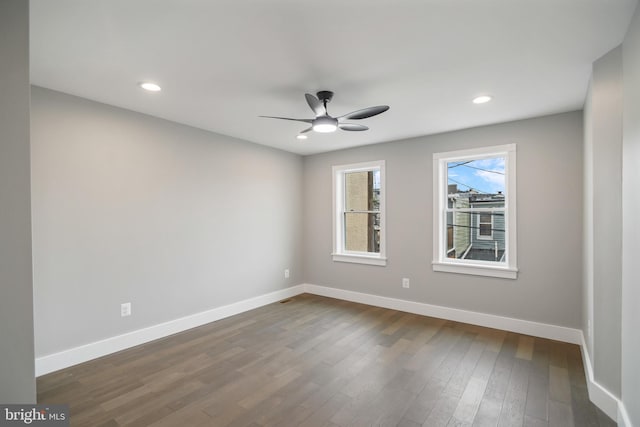 spare room with ceiling fan and hardwood / wood-style flooring