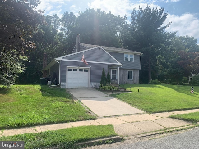 front facade with a garage and a front yard