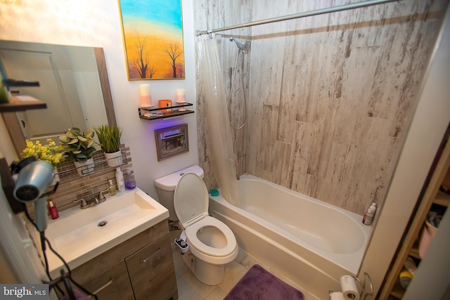 full bathroom featuring vanity, tile patterned floors, toilet, and shower / bath combo with shower curtain