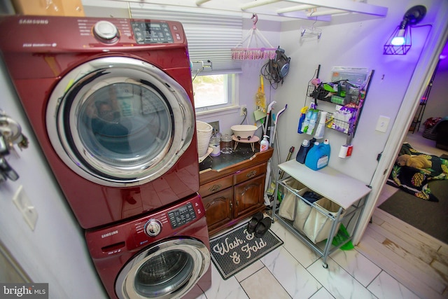 laundry area featuring stacked washing maching and dryer