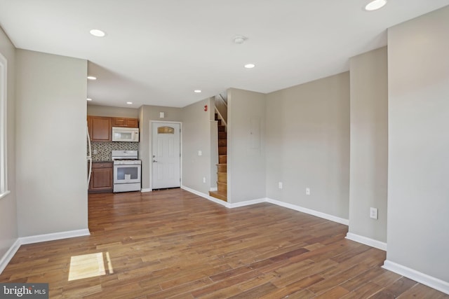 unfurnished living room featuring hardwood / wood-style floors