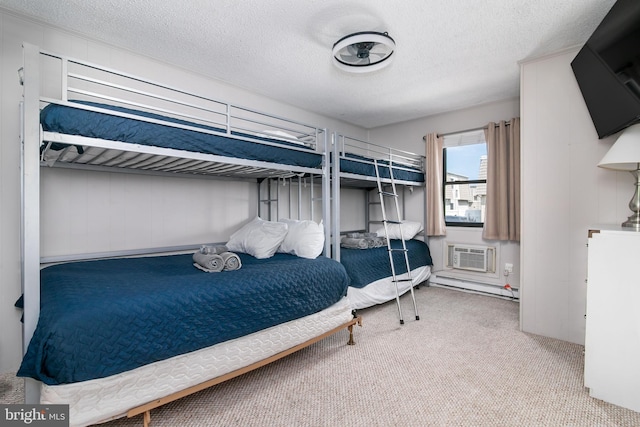 bedroom with a baseboard heating unit, light carpet, and a textured ceiling