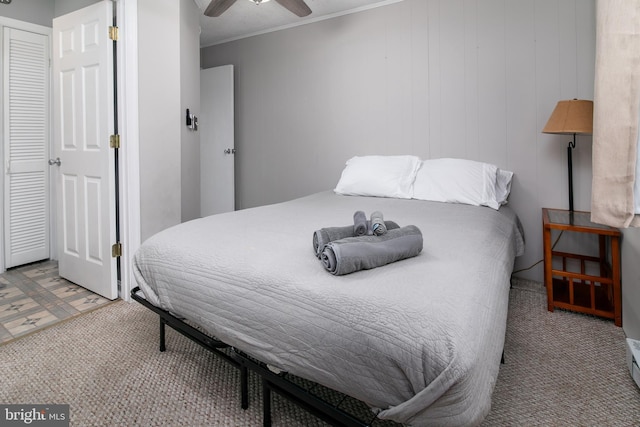 bedroom with ornamental molding and a ceiling fan