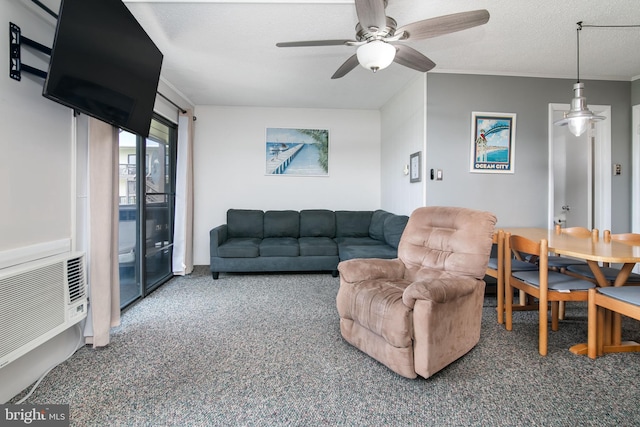 living room featuring ceiling fan, a textured ceiling, and carpet floors