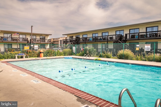 community pool with fence