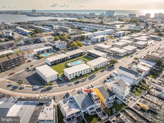 bird's eye view featuring a water view and a city view