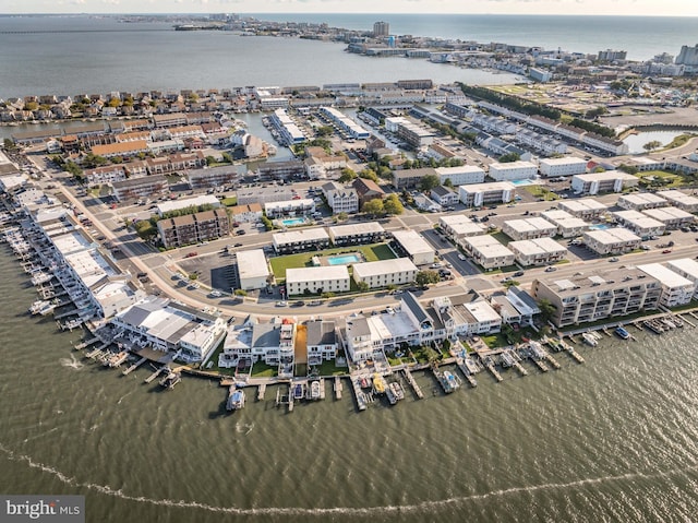 drone / aerial view featuring a view of city and a water view