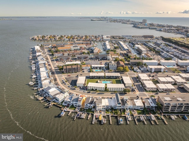 birds eye view of property featuring a view of city and a water view