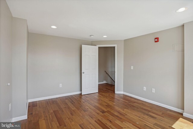 empty room featuring dark wood-type flooring