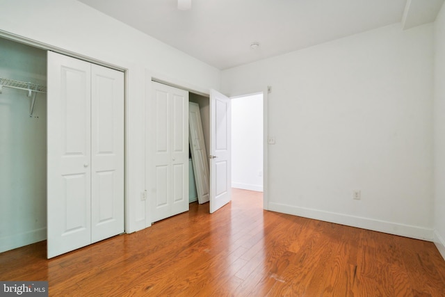 unfurnished bedroom with wood-type flooring