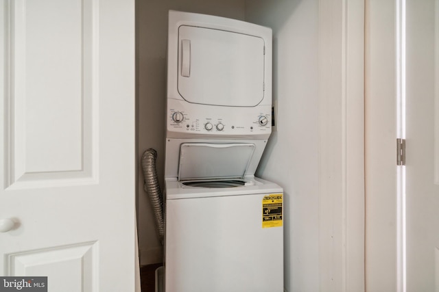 laundry area with stacked washer / drying machine