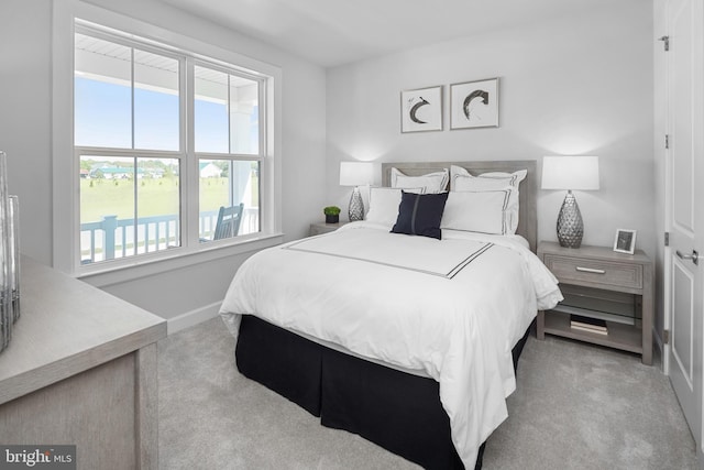 bedroom with light carpet