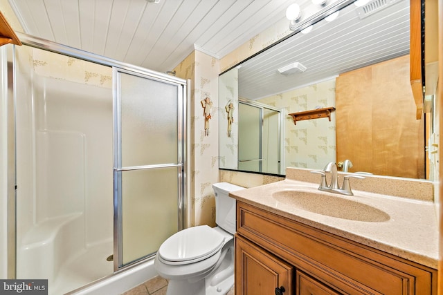 bathroom with vanity, toilet, tile patterned floors, and an enclosed shower