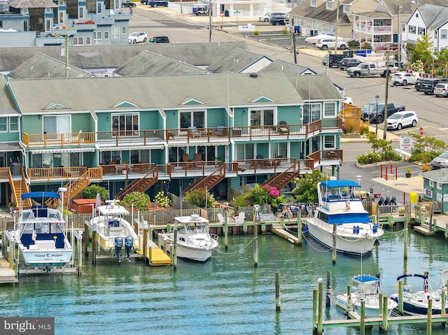 exterior space with a balcony and a water view