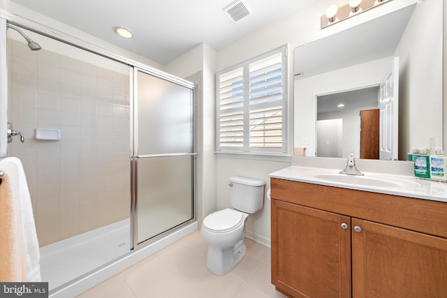 bathroom with toilet, an enclosed shower, tile patterned floors, and vanity