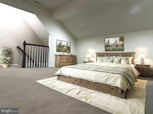 bedroom featuring carpet flooring and lofted ceiling